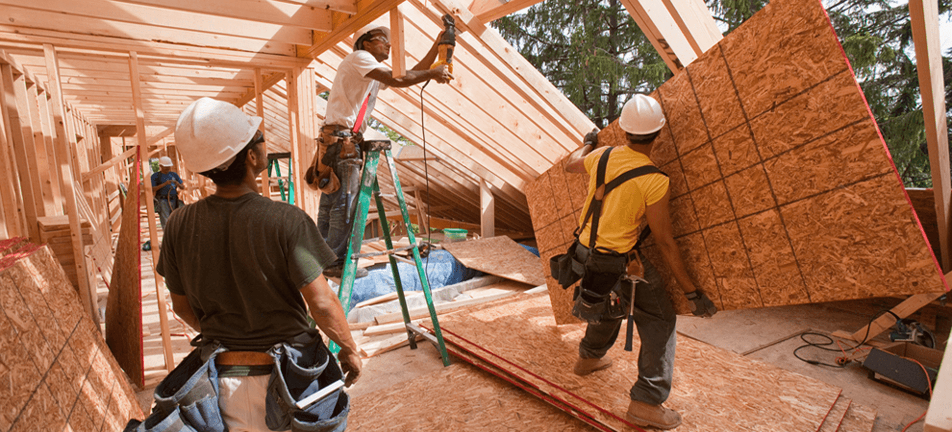 Contractors from Westside Building Materials, a local hardware store, working on a house.