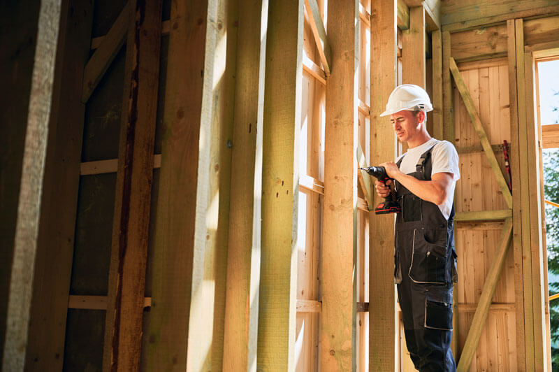 contractor building house with tools from local hardware store